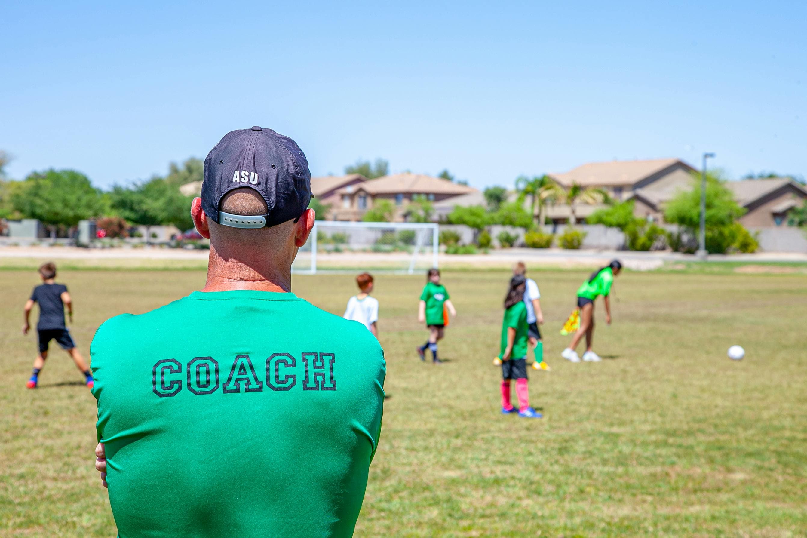 Coach observing training